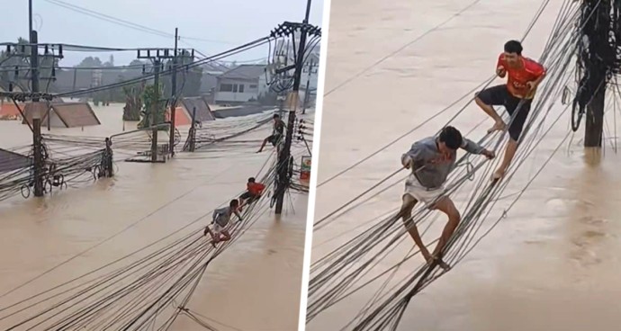Ужасные кадры из Таиланда: люди спасаются, передвигаясь по проводам во время смертельного наводнения Ужасные кадры из Таиланда: люди спасаются, передвигаясь по проводам во время смертельного наводнения