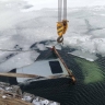 Появились кадры с места падения авто в воду с моста на Итурупе